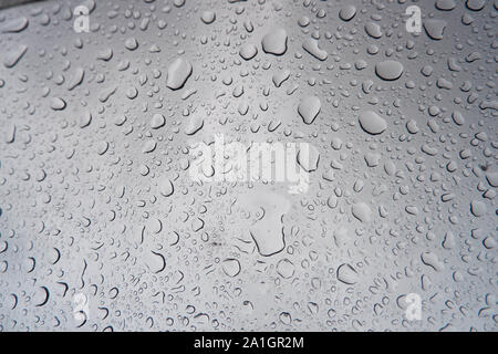 Water droplets stick on the glass surface. Stock Photo