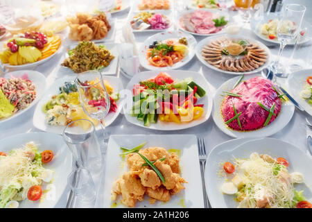 Beautifully decorated catering banquet table with different food Stock Photo