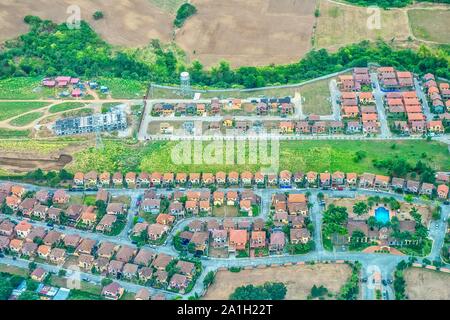 Aerial view of new housing subdivisions in the Philippines, as population growth forces urban expansion into agricultural land near on Luzon island. Stock Photo
