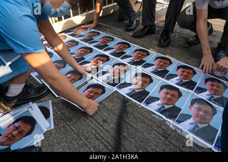 Wanchai, Hong Kong. 26 September, 2019. Human chain formed by students from local secondary schools in Hong Kong to support the pro democracy movement and anti-extradition bill. Local school students stick photos of Julius Ho to footbridge. Stock Photo