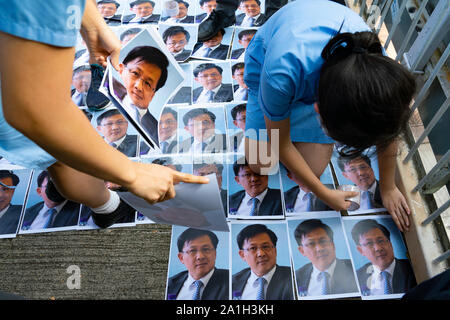 Wanchai, Hong Kong. 26 September, 2019. Human chain formed by students from local secondary schools in Hong Kong to support the pro democracy movement and anti-extradition bill. Local school students stick photos of Julius Ho to footbridge. Stock Photo