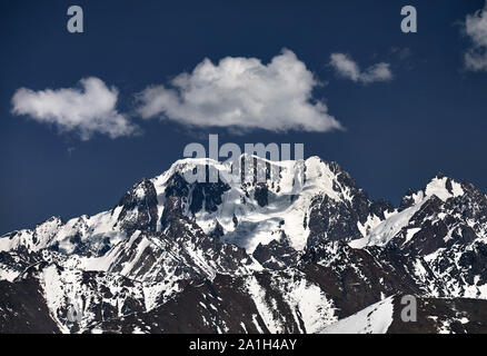 High mountains with snow and peak Talgar in Northern Tien Shan, Kazakhstan Stock Photo