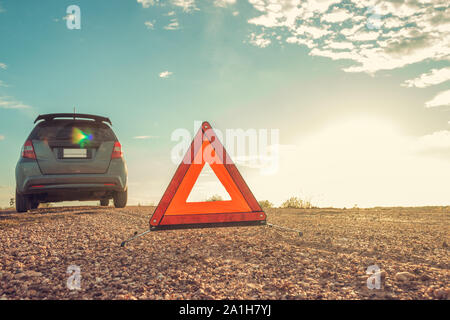 Emergency car, Stressful mood during the evening hours. Along the local road, Car broke down and waiting for help from someone. Stock Photo