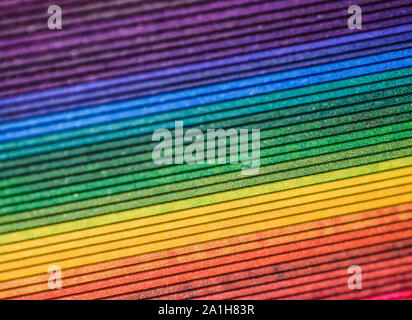 Brightly Colored Rainbow Paper  with Edges Creating Diagonal Pattern Stock Photo
