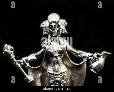Closeup of Unpainted Dungeon and Dragons Female Mage Miniature Figurine Stock Photo