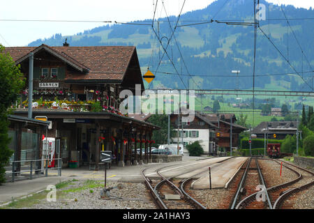 Saanen, Switzerland - July 25, 2019: The train station in Saanen is a station managed by railway company MOB (Montreux Oberland Bernois) Stock Photo