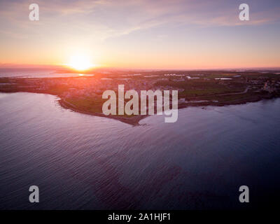 Wonderful aerial view at sunset of the coastline of Portopalo, a town in the south of Sicily. The shot is taken during a beautiful sunny day Stock Photo