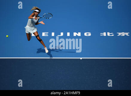 Beijing, China. 27th Sep, 2019. Gao Xinyu returns the ball during the women's singles qualification round between Kateryna Kozlova of Ukraine and Gao Xinyu of China at 2019 WTA China Open tennis tournament in Beijing, capital of China, Sept. 27, 2019. Credit: Li Yibo/Xinhua/Alamy Live News Stock Photo