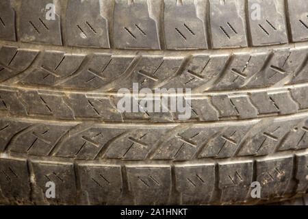 Close View of an old tyre with grooves and patterns. Stock Photo