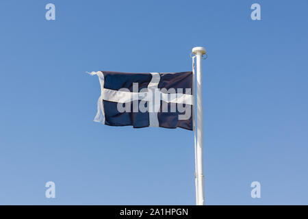Saint Piran's Flag or Baner Peran in the Cornish language a white cross on a black background is the emblem of Cornwall England Stock Photo