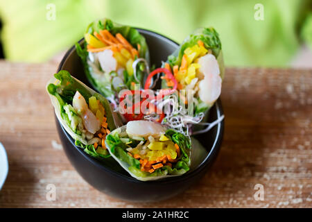 Chinese rolls with shrimps and vegetables and sweet chilli sauce Stock Photo