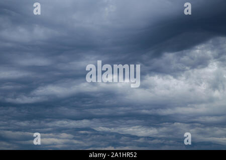 Dark and stormy clouds before the arrival of a thunderstorm in summer Stock Photo