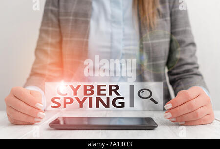 Handwriting text writing Cyber Spying. Conceptual photo form of cyber attack that steals classified or sensitive data Business woman sitting with mobi Stock Photo