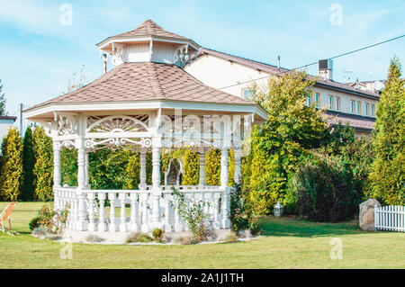 View of beautiful wedding arbour/venue in green garden Stock Photo