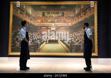 London Sotheby's, London, UK. 27 Sept 2019 - Technicians view ÔBanksyÕs artwork titled 'Dystopian View of The House of Commons Comes to London' Est -£1.5 C £2 million during the preview of SothebyÕs Frieze Week Contemporary Art Sale. The auction will take place on 3rd October 2019.   Credit: Dinendra Haria/Alamy Live News Stock Photo