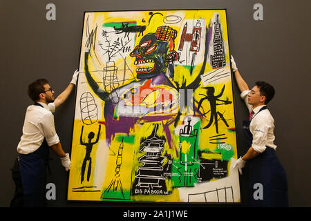 London Sotheby's, London, UK. 27 Sept 2019 - Technicians hold Jean-Michel Basquiat's artwork titled 'Pyro' during the preview of SothebyÕs Frieze Week Contemporary Art Sale. The auction will take place on 3rd October 2019.  Credit: Dinendra Haria/Alamy Live News Stock Photo