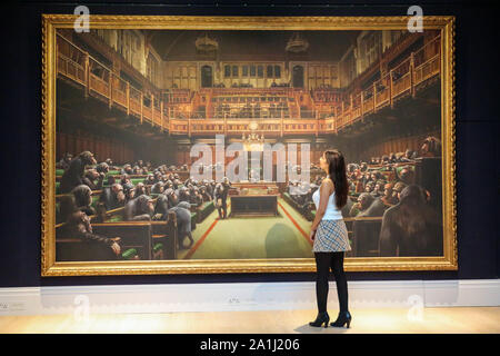 London Sotheby's, London, UK. 27 Sept 2019 - A staff member view ÔBanksyÕs artwork titled 'Dystopian View of The House of Commons Comes to London' Est -£1.5 C £2 million during the preview of SothebyÕs Frieze Week Contemporary Art Sale. The auction will take place on 3rd October 2019   Credit: Dinendra Haria/Alamy Live News Stock Photo