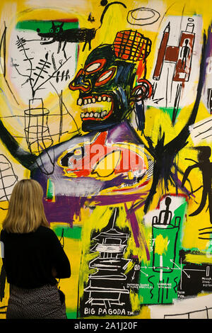 London Sotheby's, London, UK. 27 Sept 2019 - A staff member view Jean-Michel Basquiat's artwork titled 'Pyro' during the preview of SothebyÕs Frieze Week Contemporary Art Sale. The auction will take place on 3rd October 2019.  Credit: Dinendra Haria/Alamy Live News Stock Photo