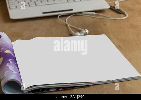 Blank glossy magazine on wooden background. Mockup for design. Copy space. Stock Photo