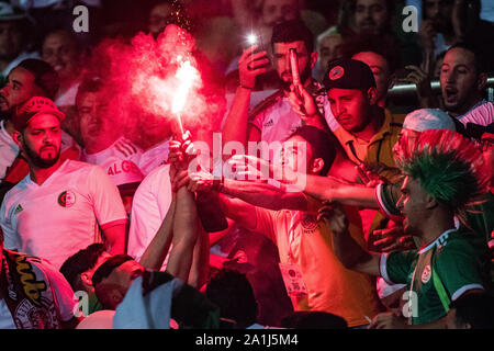CAIRO, EGYPT - JUNE 23: Algeria fans set off flares during the 2019 Africa Cup of Nations Group C match between Algeria and Kenya at 30 June Stadium o Stock Photo