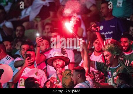 CAIRO, EGYPT - JUNE 23: Algeria fans set off flares during the 2019 Africa Cup of Nations Group C match between Algeria and Kenya at 30 June Stadium o Stock Photo
