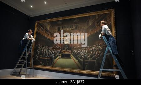 London, UK. 27th Sep 2019.Photo call for Banksy's Devolved Parliament painting ahead of it being offered at auction by Sotheby's. The artwork showing the House of Commons full of chimpanzees is expected to fetch GBP1.5 to GBP2 million. Photo by Ioannis Alexopoulos / Alamy Live News. Stock Photo