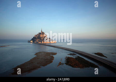Le Mont Saint-Michel (St Michael’s Mount) in Normandy, north-western France, on 2019/02/22: aerial view of the mount surrounded by water during a spri