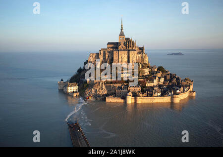 Le Mont Saint-Michel (St Michael’s Mount) in Normandy, north-western France, on 2019/02/22: aerial view of the mount surrounded by water during a spri Stock Photo