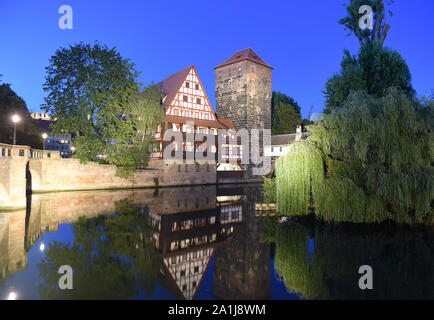 Nuremberg cityscape at night. View on Weinstadel and Wasserturm in old city Nuremberg, Germany. Stock Photo