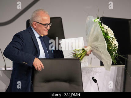 27 September 2019, Hessen, Frankfurt/Main: Fritz Keller , the new DFB President, receives a bouquet of flowers after his election. The Bundestag of the German Football Association (DFB) is under the motto 'Bund für die Zukunft - Im Team den Fußball gestalten'. Photo: Boris Roessler/dpa Stock Photo