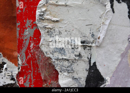closeup details of Torn and weathered advertising poster layers Stock Photo
