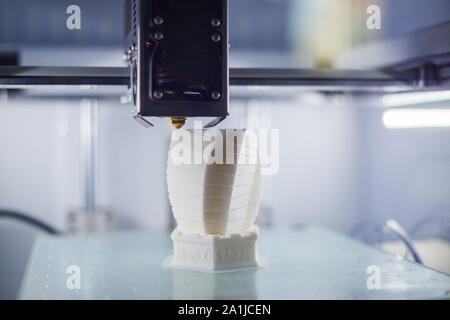 Modern 3D printer machine printing plastic model Stock Photo