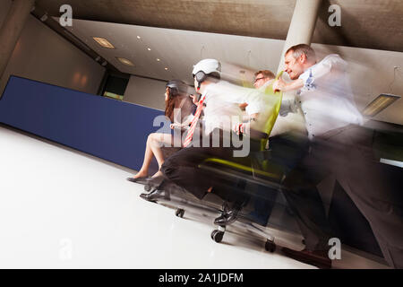 Teams in office chair race. Stock Photo