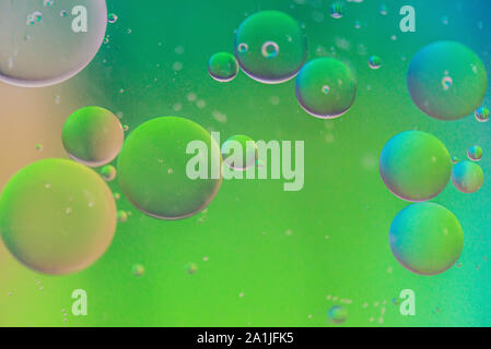 Defocused green defocused abstract background picture made with oil, water and soap Stock Photo