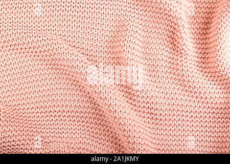 Soft and cozy heavy knit blanket, pullover, sweater. Structure of cotton knit fabric/material. As background for fashion theme, knitting etc. Stock Photo