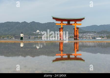 Itsukushima Floating Torii Gate in Water, Isukushima Shrine, Miyajima Island, Hiroshima Bay, Japan Stock Photo
