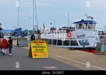 Customers boarding the popular Brownsea Island Ferry for the short crossing to the isolated island in Poole Harbour.transport Stock Photo