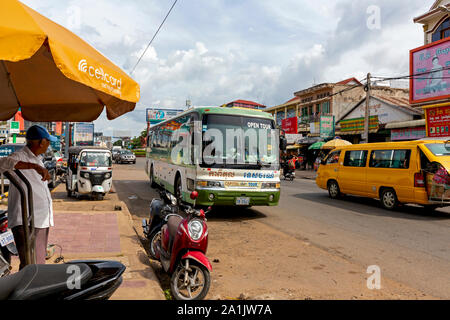 A Capital Tours bus is seen on a busy street in Kampong Cham, Cambodia. Stock Photo