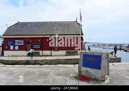 Poole lifeboat museum & gift shop, housing one of Poole’s historic lifeboats, Thomas Kirk Wright.WWII Remembrance plaque. Stock Photo