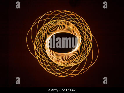 Light trails and patterns against black background Stock Photo
