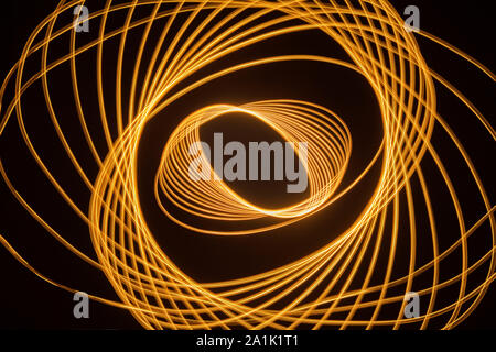 Light trails and patterns against black background Stock Photo