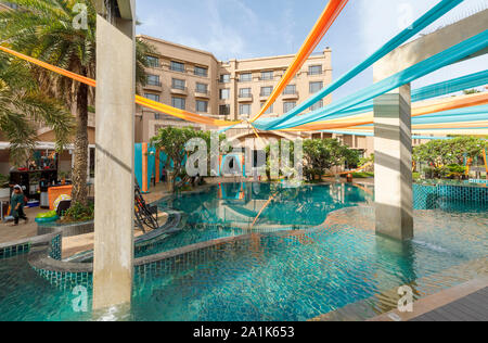 Modern swimming pool at the Radisson Blu Plaza Hotel at Mahipalpur near Delhi Airport in New Delhi, capital city of India Stock Photo