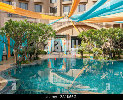 Modern swimming pool at the Radisson Blu Plaza Hotel at Mahipalpur near Delhi Airport in New Delhi, capital city of India Stock Photo