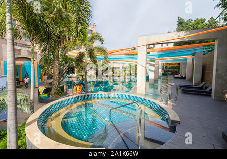 Modern swimming pool at the Radisson Blu Plaza Hotel at Mahipalpur near Delhi Airport in New Delhi, capital city of India Stock Photo