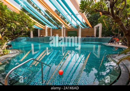 Modern swimming pool at the Radisson Blu Plaza Hotel at Mahipalpur near Delhi Airport in New Delhi, capital city of India Stock Photo