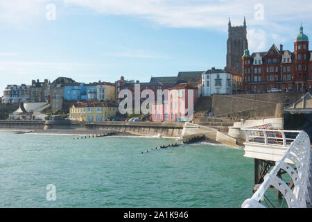 View of the town and church tower of St Peter and Paul in Cromer, Norfolk, as seen from the famous pier Stock Photo