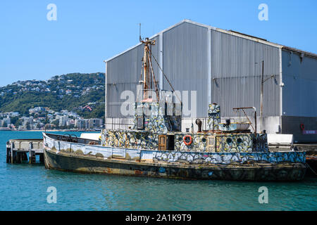 Graffiti style painted boat, SEALION, berthed at Queens Wharf, Wellington, New Zealand. Stock Photo