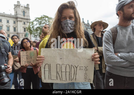 Westminster, London, UK. 27th Sept, 2019. Students, school children and adults protest for the climate, demanding that governments take the necessary action to decrease carbon dioxide emissions and act in accordance with the Paris Agreement. Penelope Barritt/Alamy Live News Stock Photo