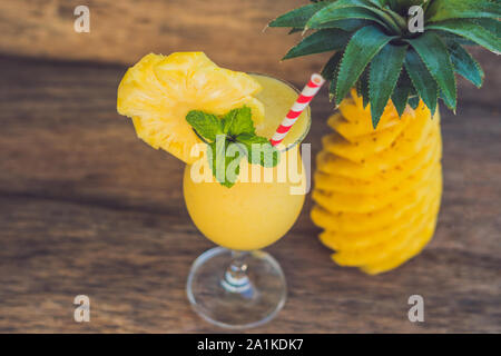 Pineapple and pineapple smoothies on an old wooden background Stock Photo