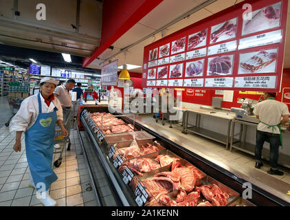 Beijing, China. 27th Sep, 2019. Chinese shop for pork at one of several American Walmart Supercenter stores in Beijing on Friday, September 27, 2019. Walmart, the world's largest retailer, remains very popular with Chinese consumers despite the current trade war between the U.S. and China. Photo by Stephen Shaver/UPI Credit: UPI/Alamy Live News Stock Photo